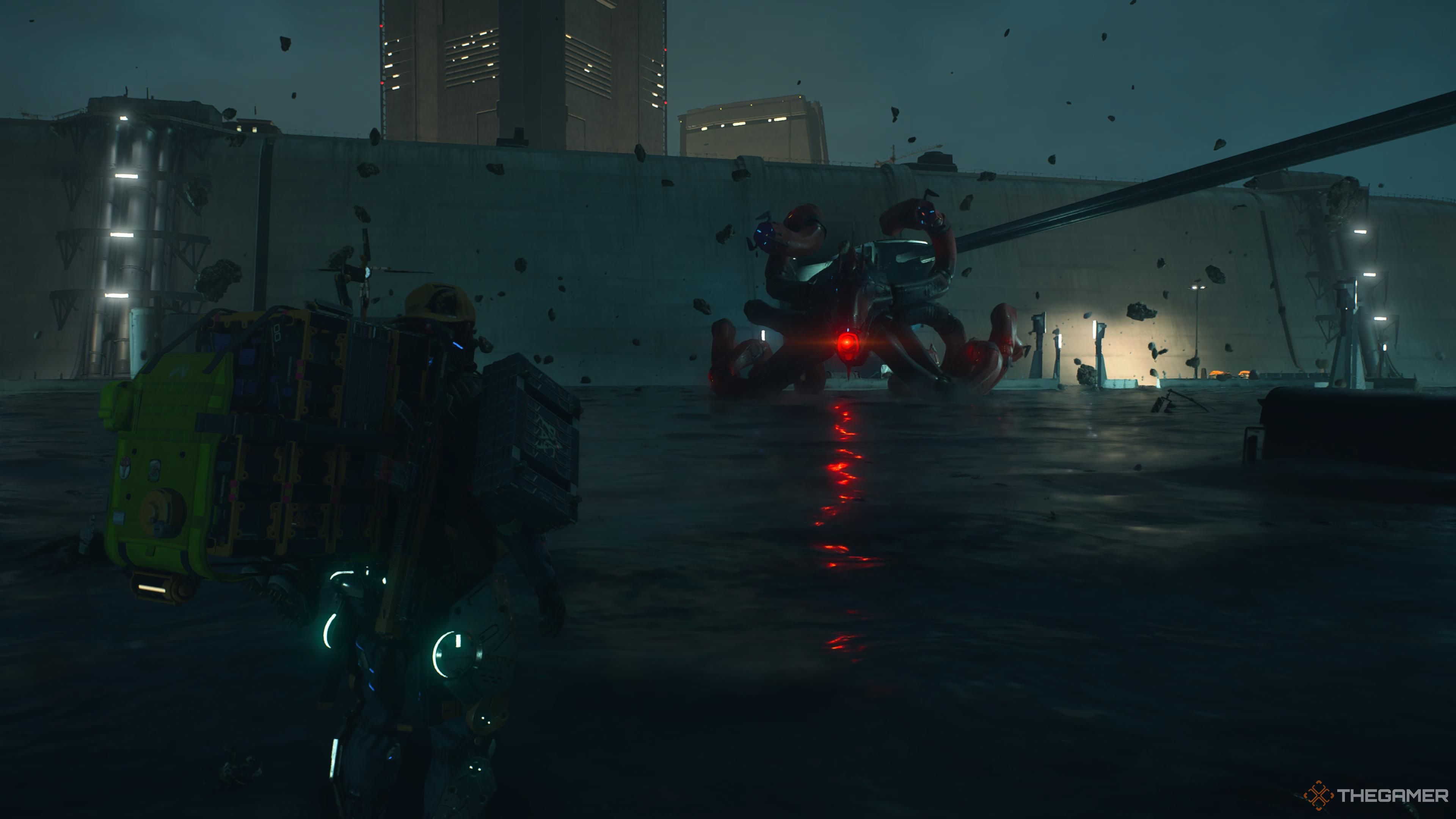 sam in a large area covered with tar with the mech octopus in death stranding 2 on the beach.