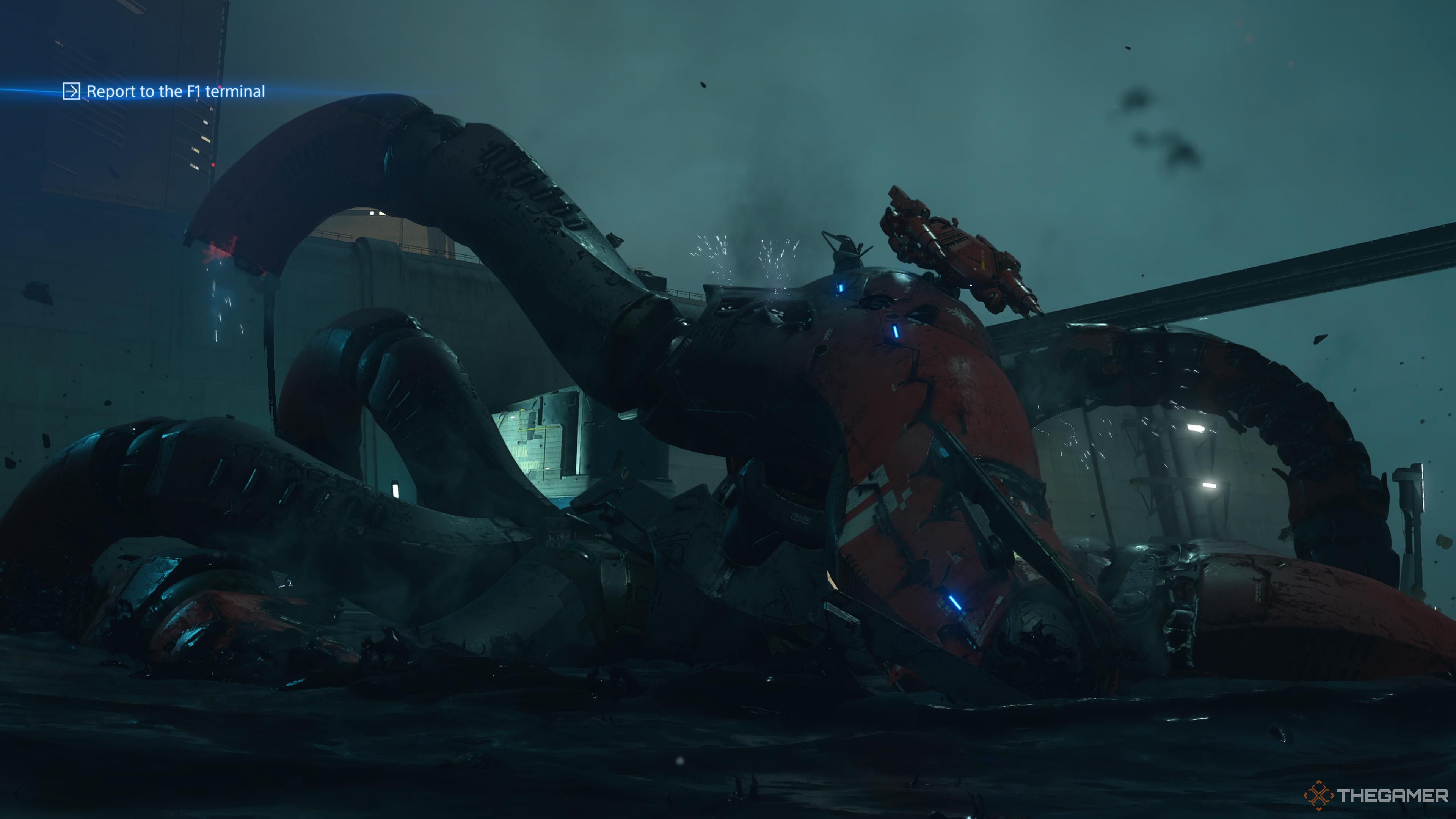 the destroyed mecha octopus sinking into tar in death stranding 2 on the beach.