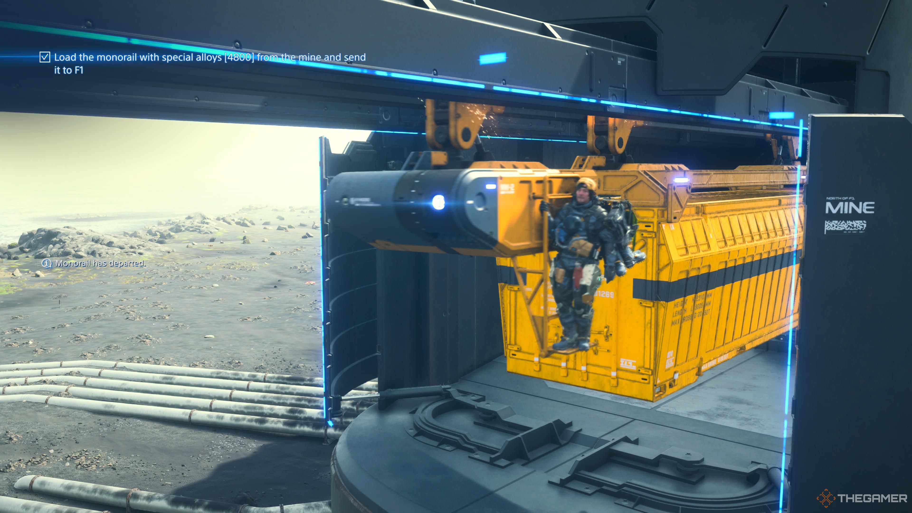 Sam exiting a mine on the monorail in death stranding 2 on the beach.