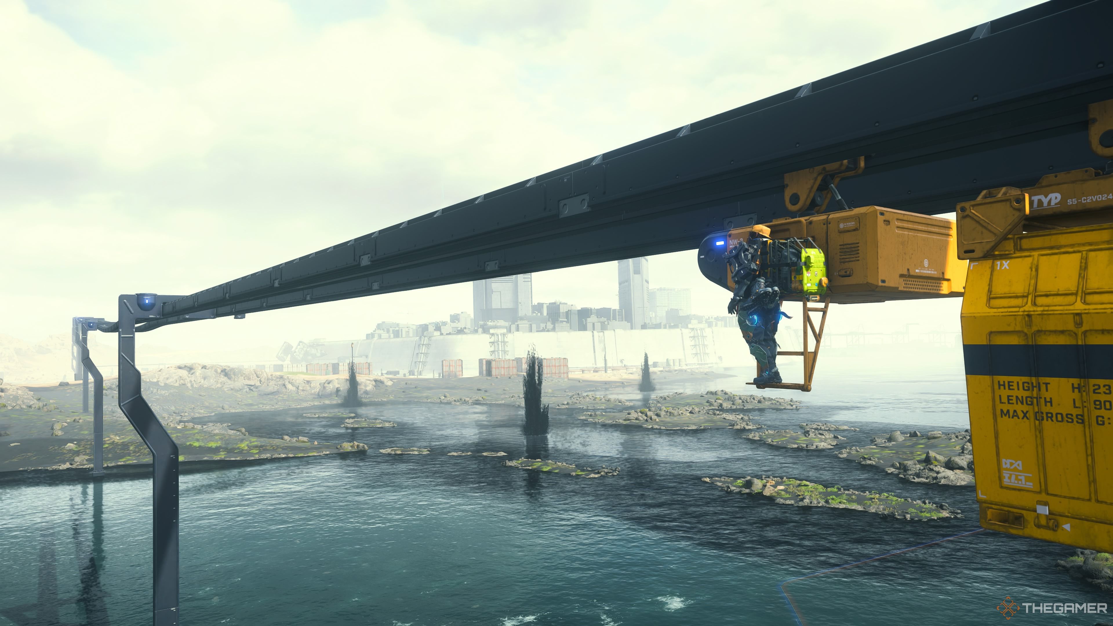 Sam riding on a monorail in death stranding 2 on the beach.
