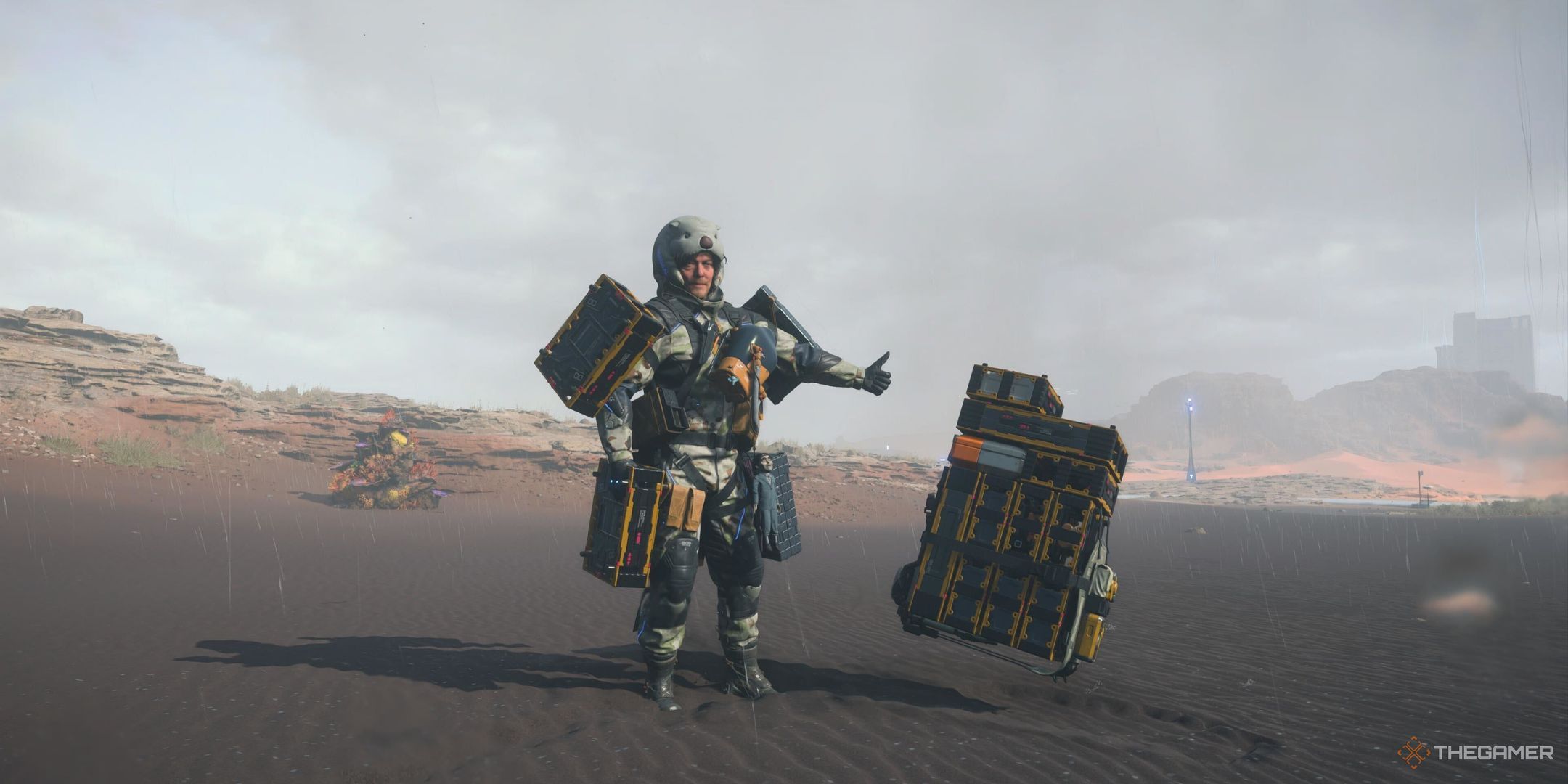 Sam standing next to a dropped backpack in Death Stranding 2: On the Beach.