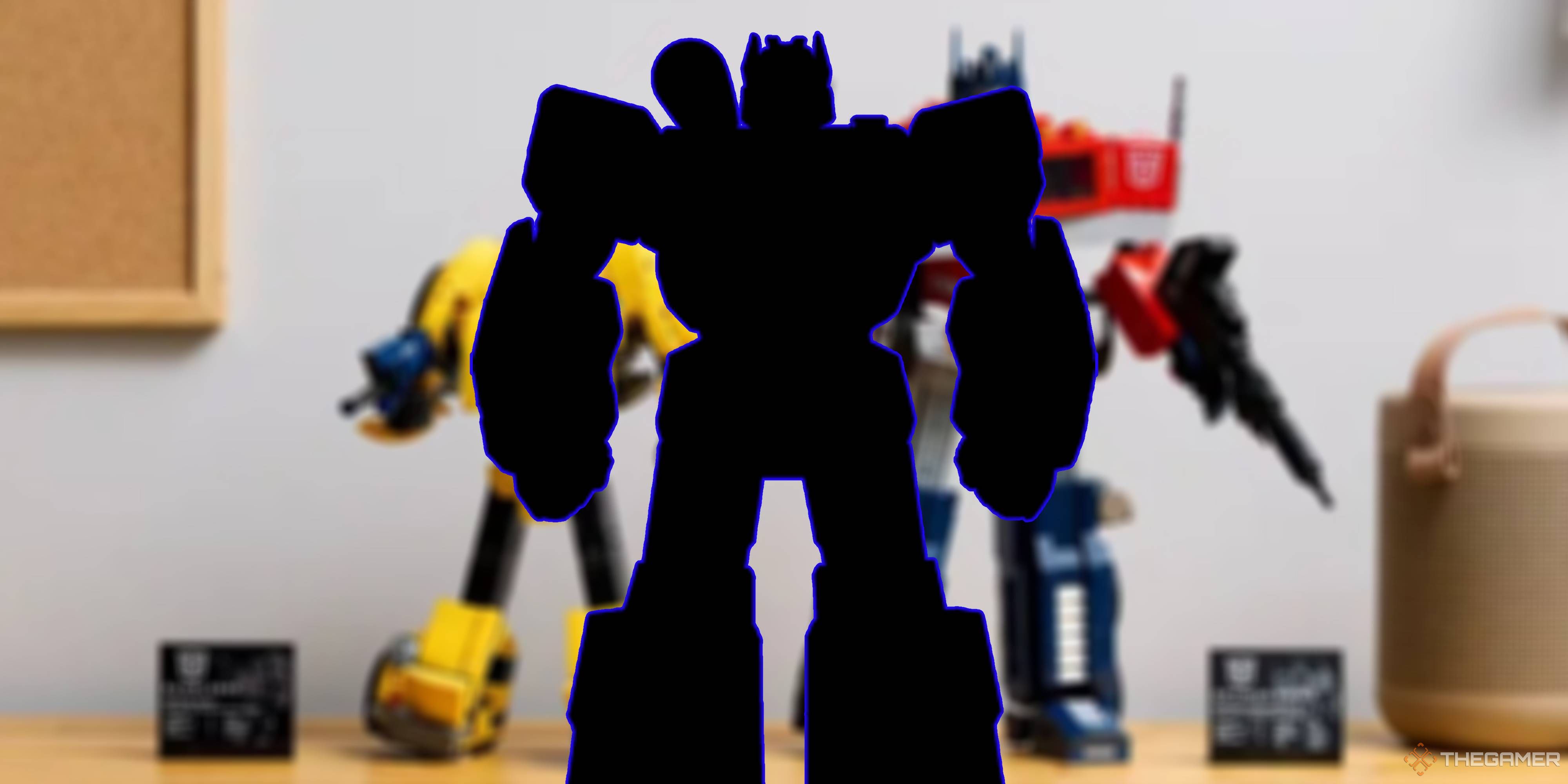 soundwave silhouette on a blurred transformers lego optimus prime and bumblebee background.