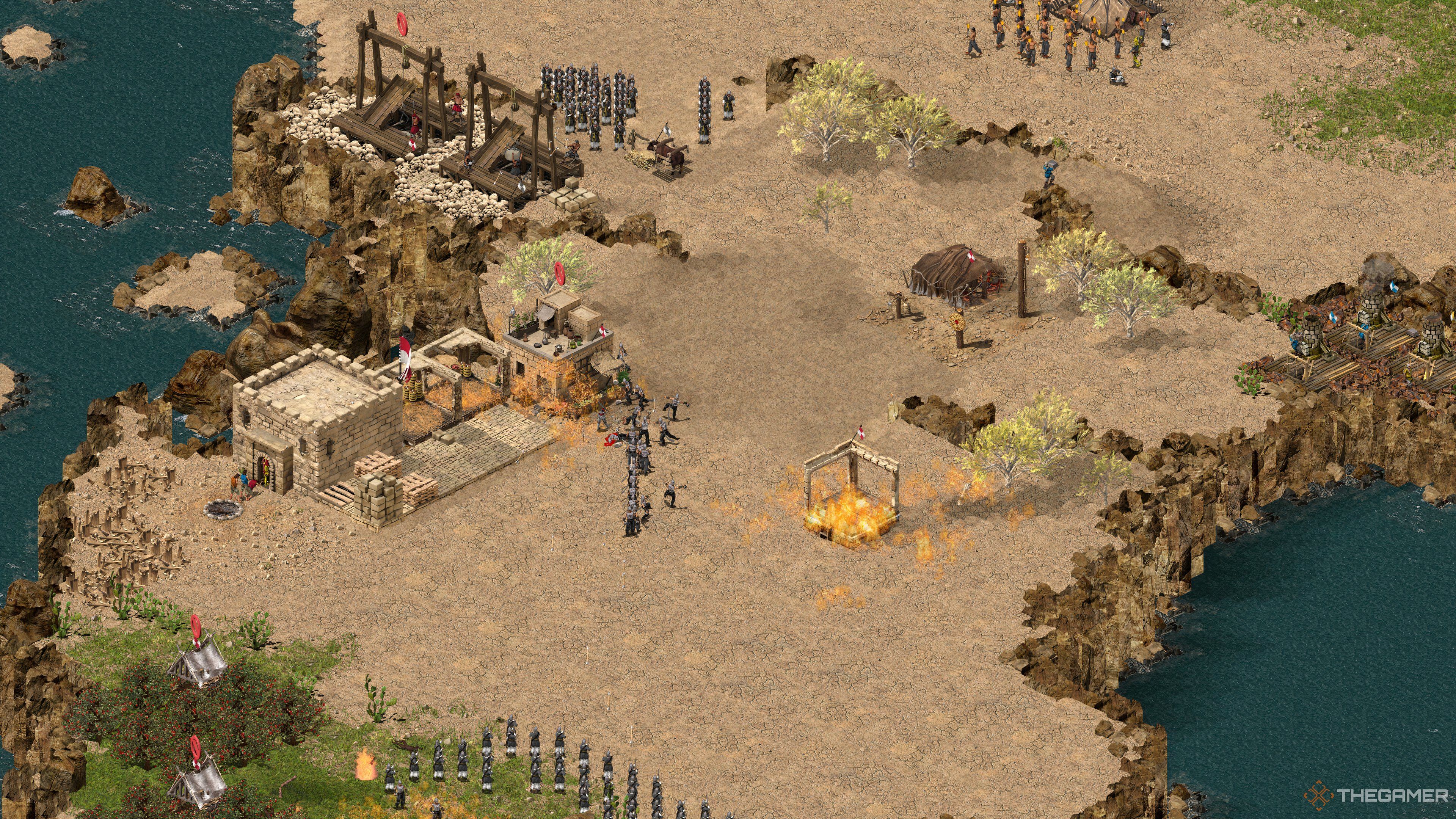 Player getting absolutely destroyed in a four versus one AI fight in Stronghold Crusader Definitive Edition.