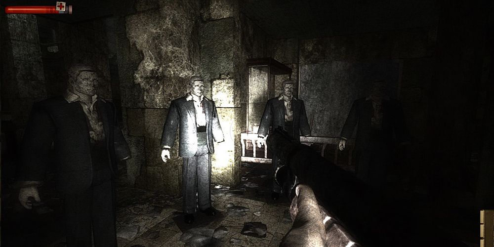 Condemned Criminal Origins - Zombie-Like Creatures Standing In A Dark, Filthy Room