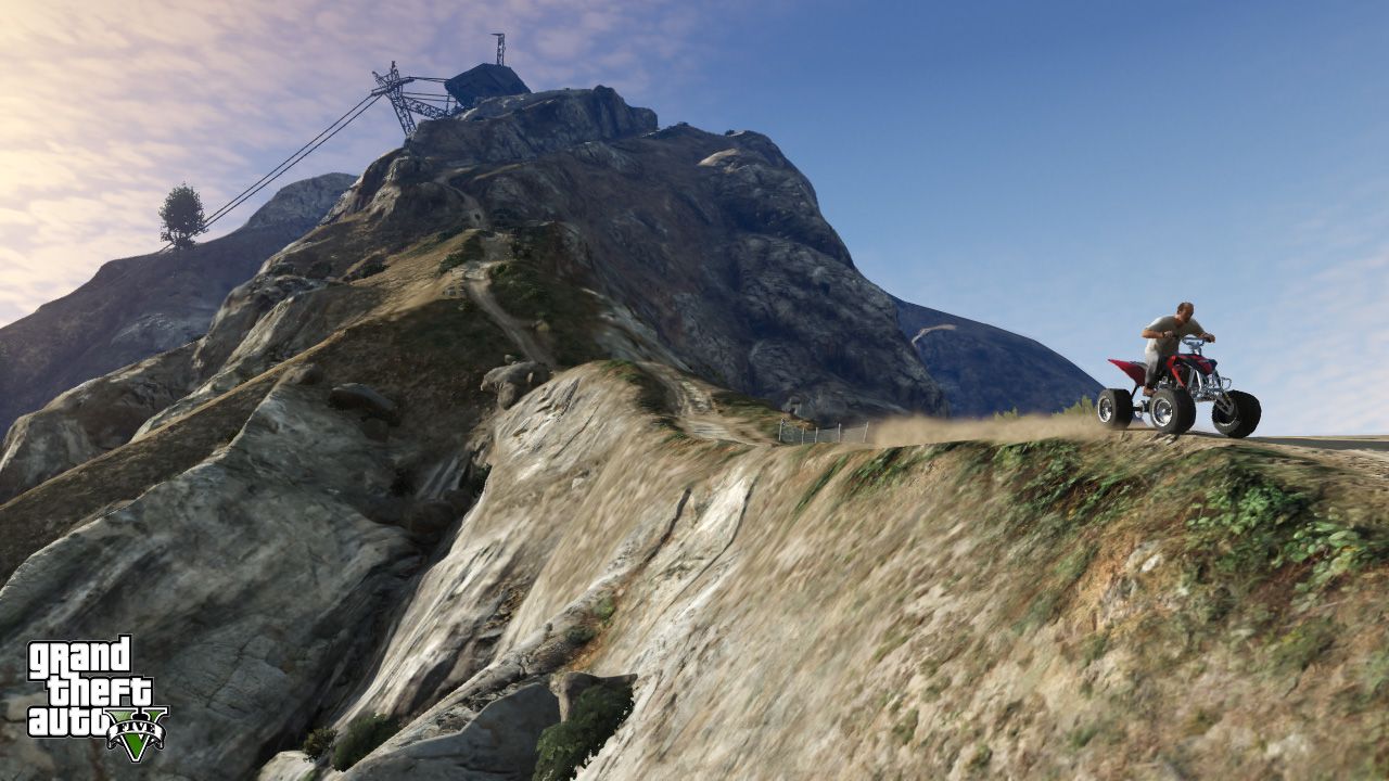 someone on a quadbike on a narrow trail on mount chilliad in gta 5