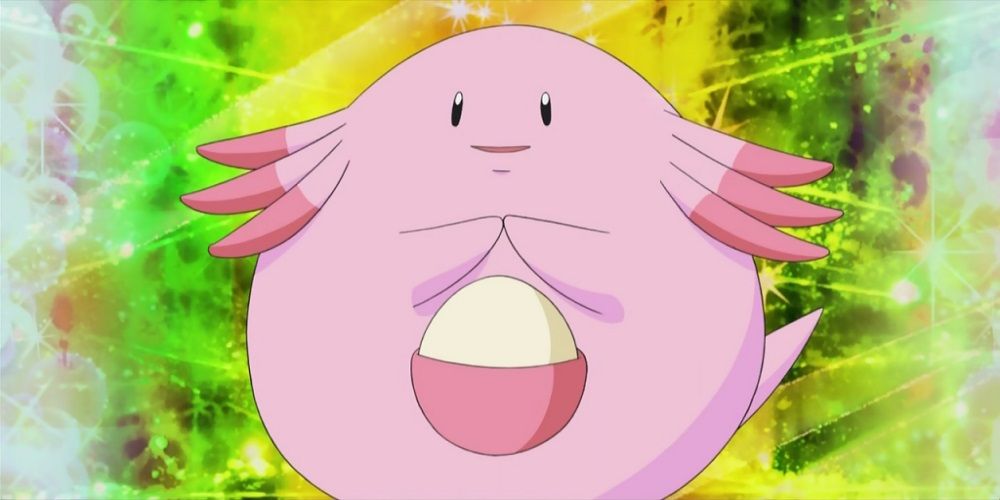 Pokemon: Chansey stands, hands together, smiling.