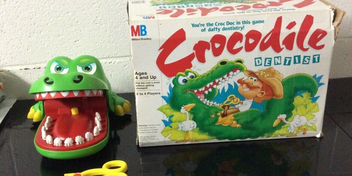 Crocodile dentist board game box and plastic crocodile figure