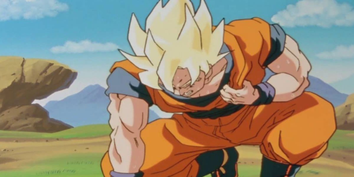 Dragon Ball Z screenshot of Goku crouching while holding his heart.