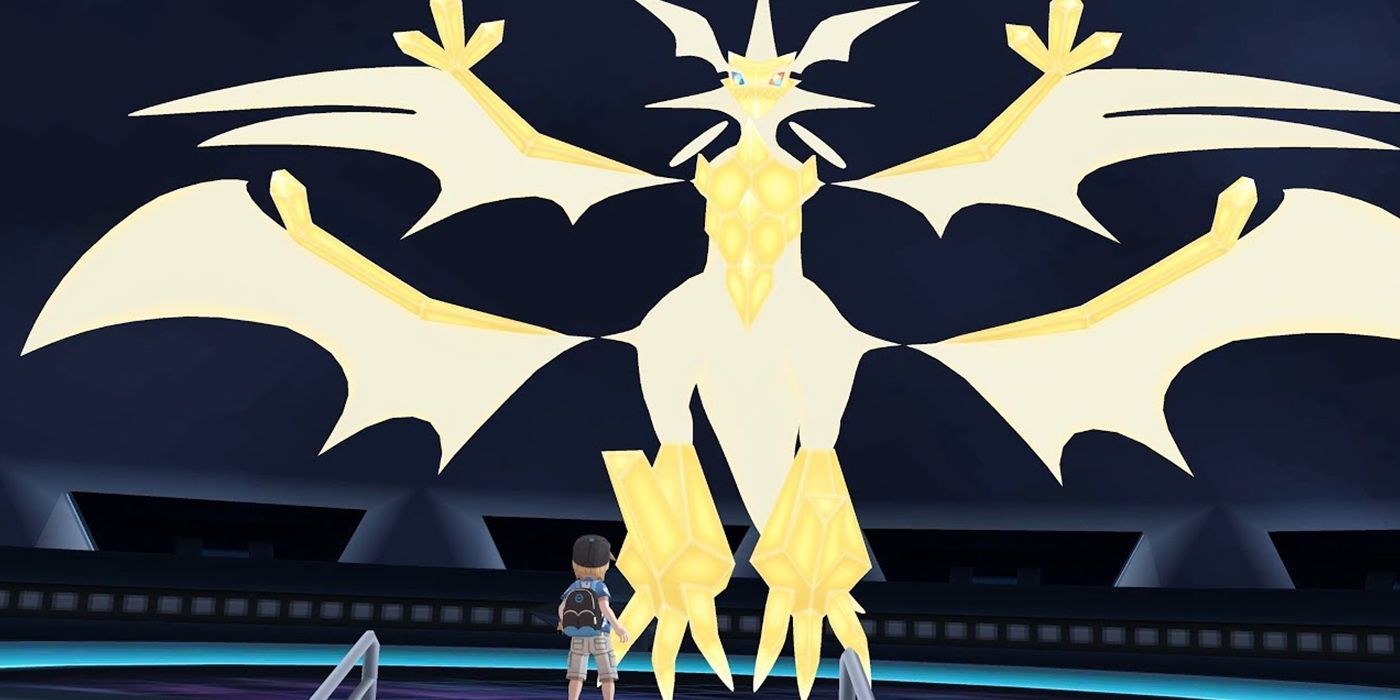 Pokemon Ultra Beasts: Necrozma towers over a trainer.