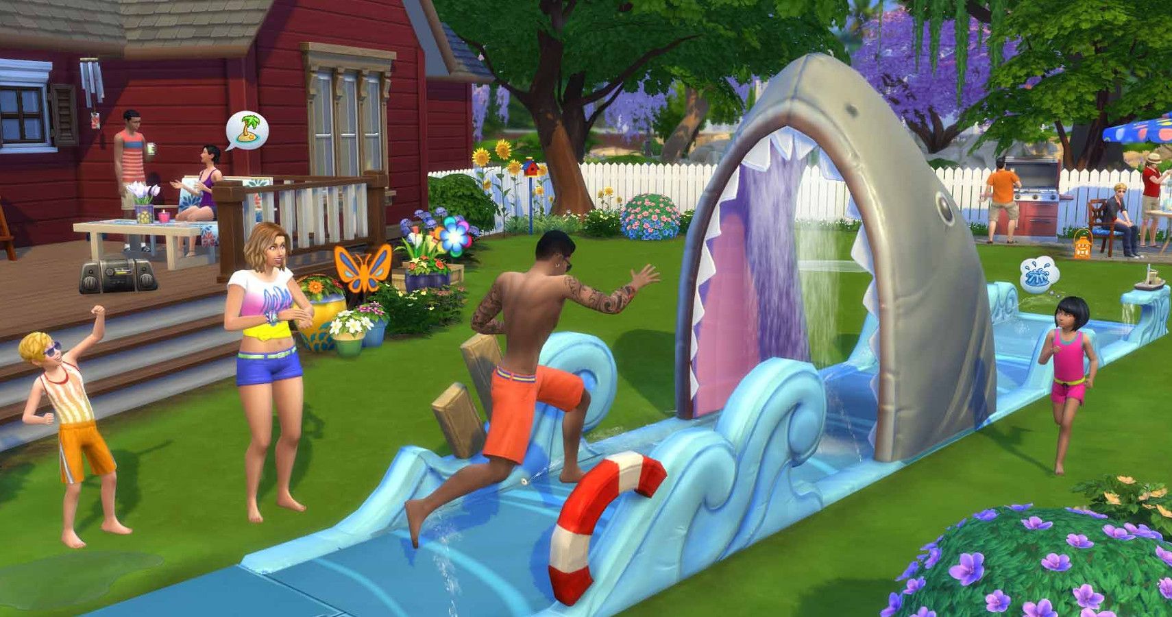 A family playing slip n slide in the yard
