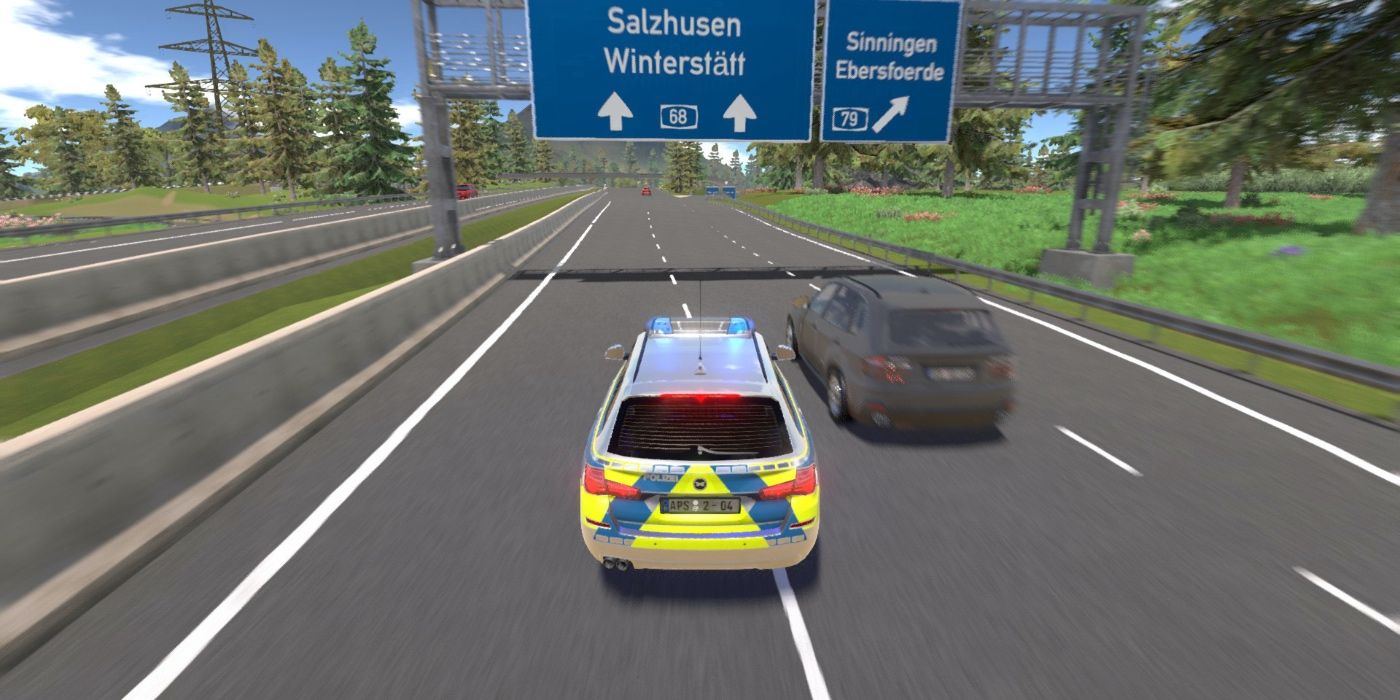A police car pulls over a vehicle on the highway
