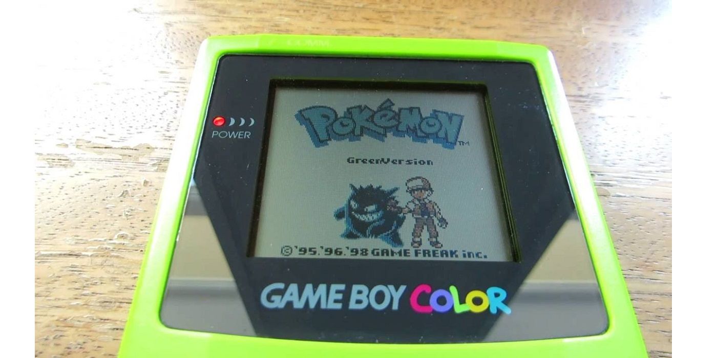 Yellow Game Boy Color playing green tinted Pokemon Green intro screen