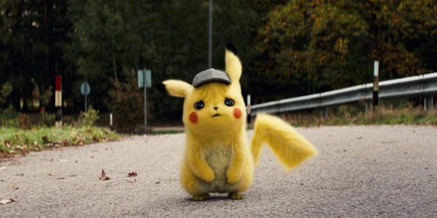 Detective Pikachu stumbles down a road while looking sad