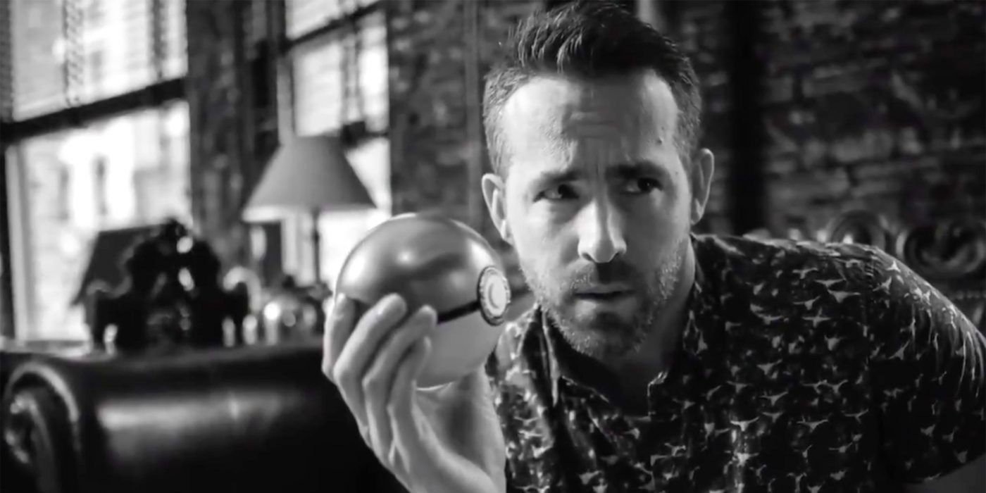 Ryan Reynolds holds a Poke Ball