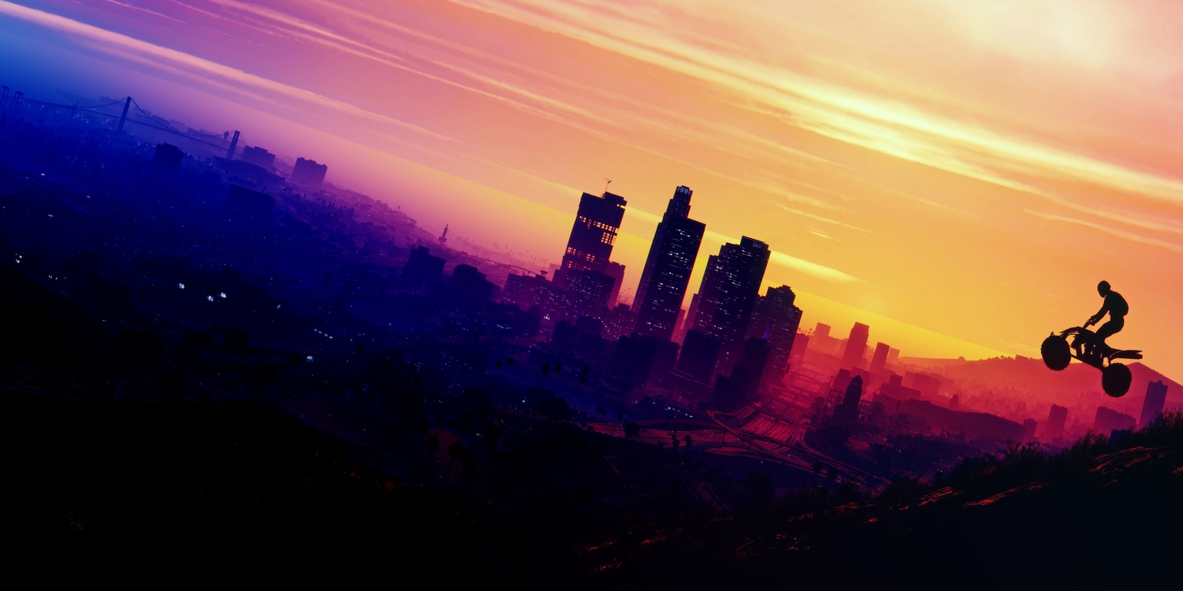 A person rides a bike as the sun sets over Los Santos in GTA 5