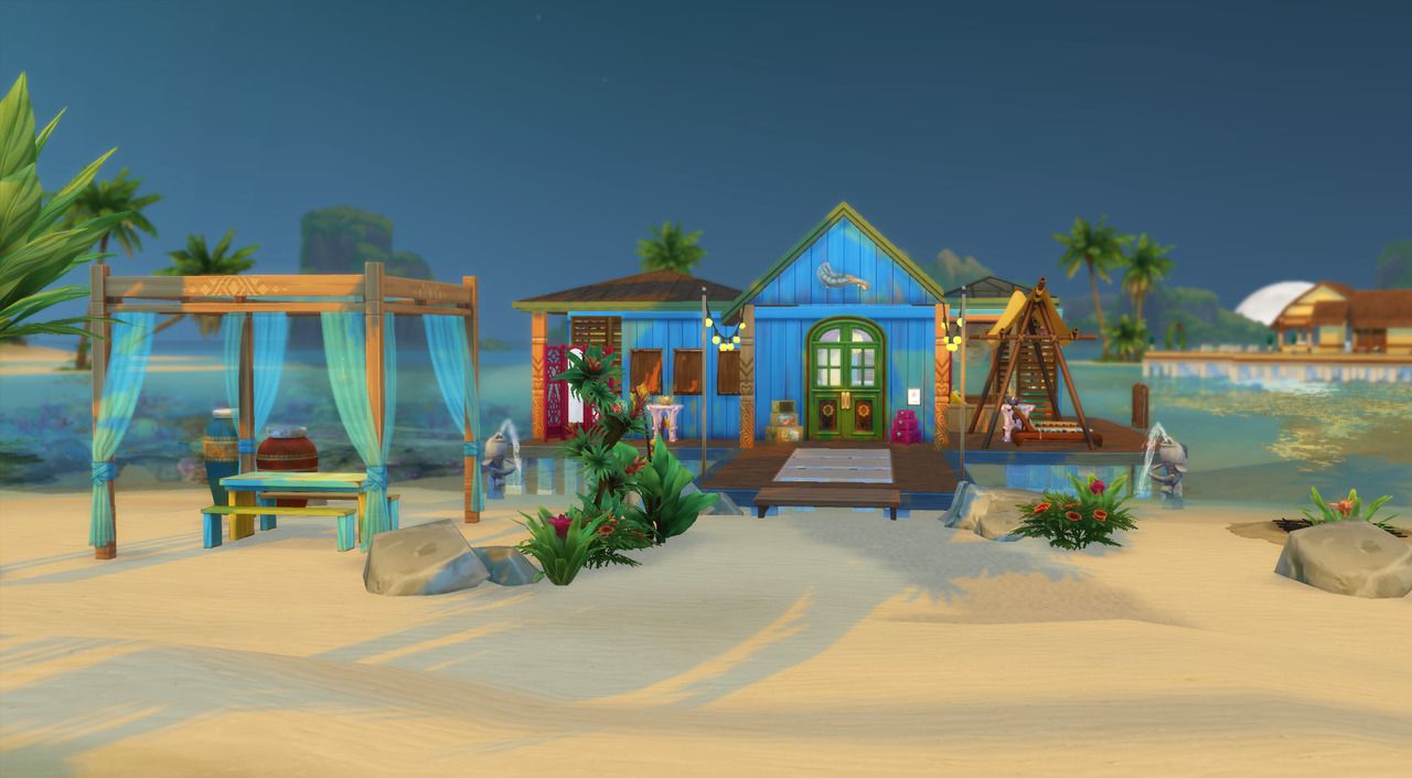 house at the end of a beach, sitting area outside
