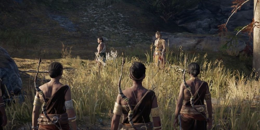 The Daughters of Artemis standing in a field in Assassin's Creed Odyssey