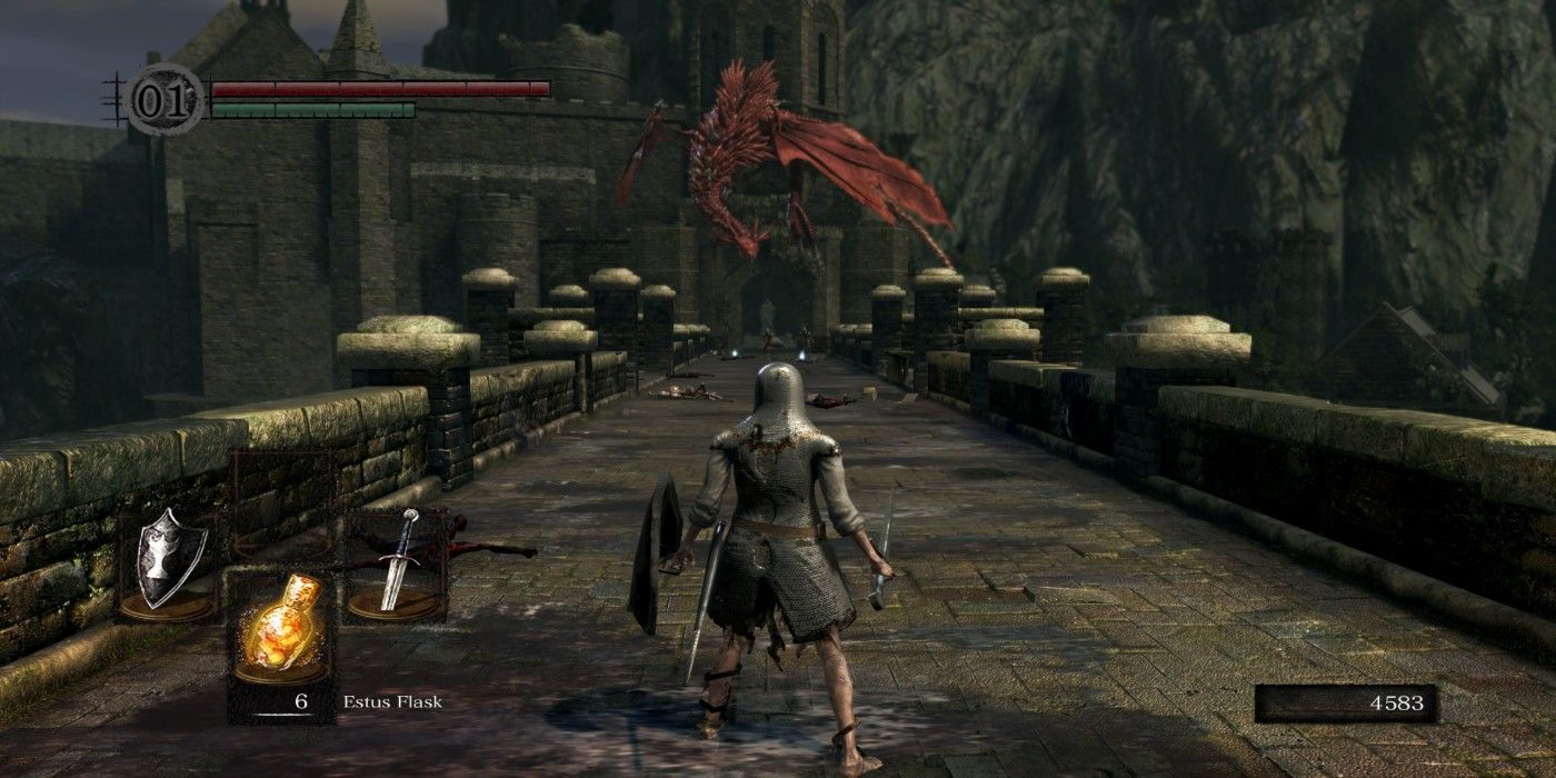 Character facing the red Dragon at the end of castle bridge in Dark Souls Remastered.