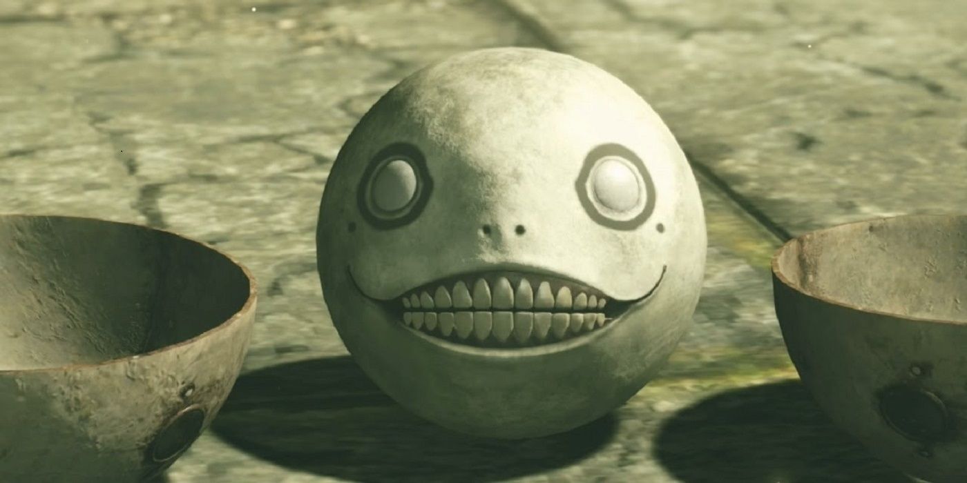Emil's disembodies head smiles at the player in Nier: Automata