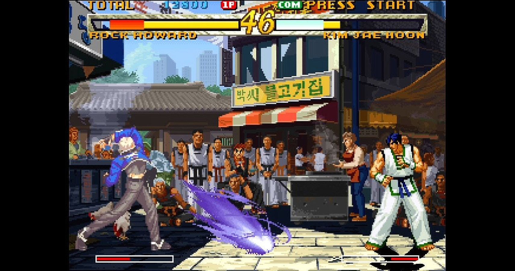 Rock Howard sends a projectile attack towards Kim Jae Hoon in Garou: Mark Of The Wolves.