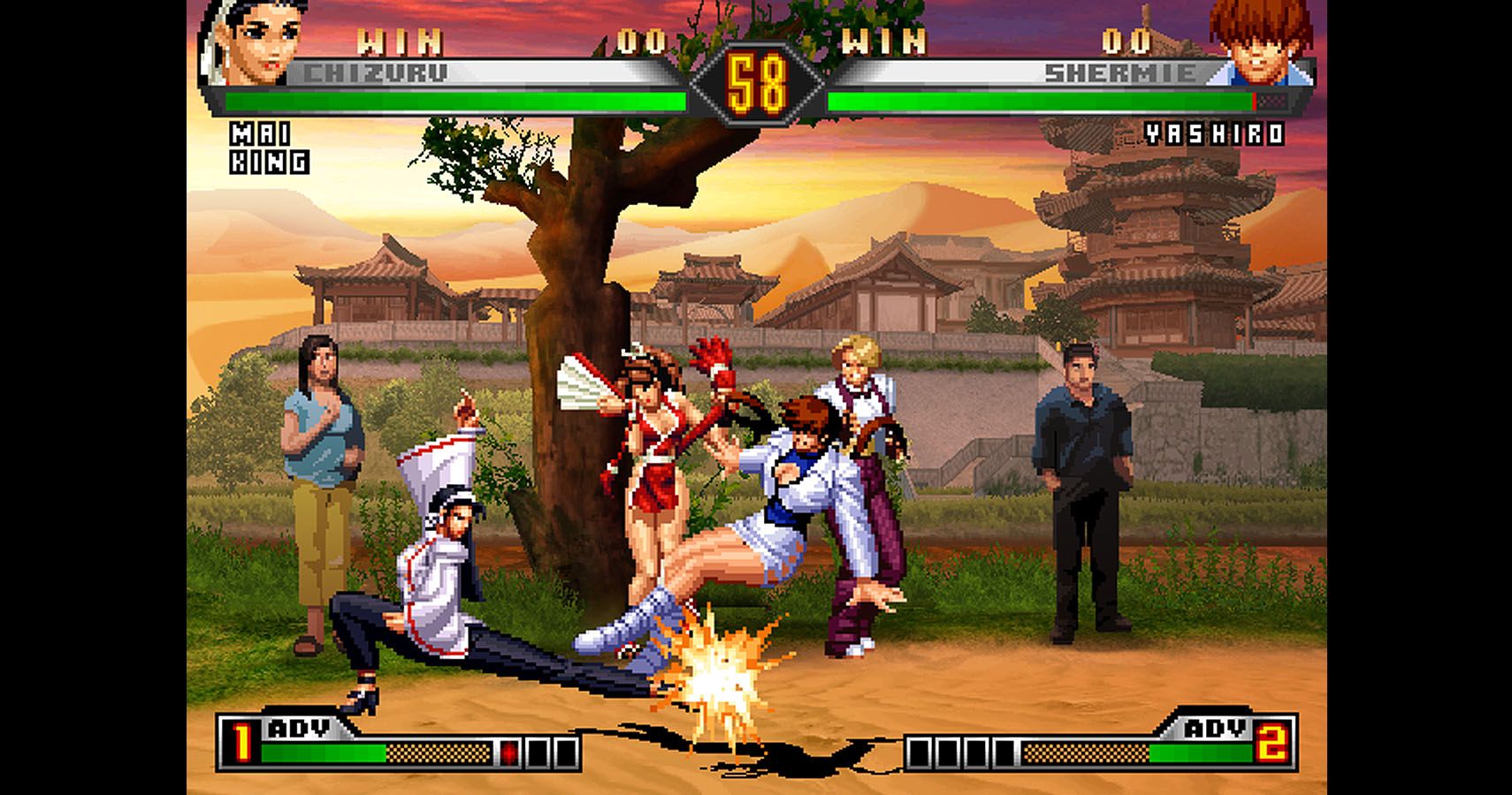 Chizuru attacks Shermie, while Mai and King watch in The King Of Fighters '98 UM.