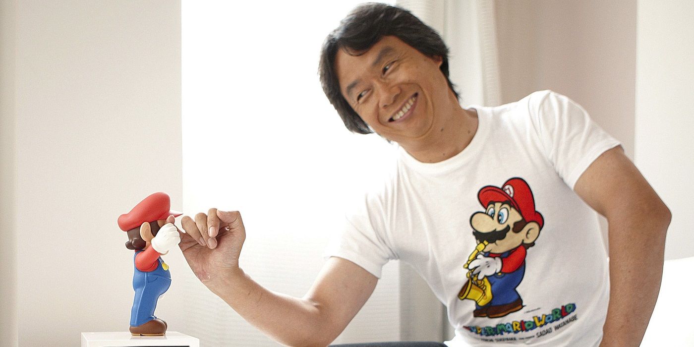 Shigeru Miyamoto with mario doll