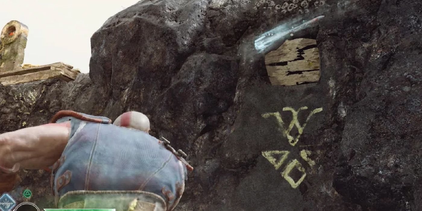 kratos throwing an axe at runes on a rock