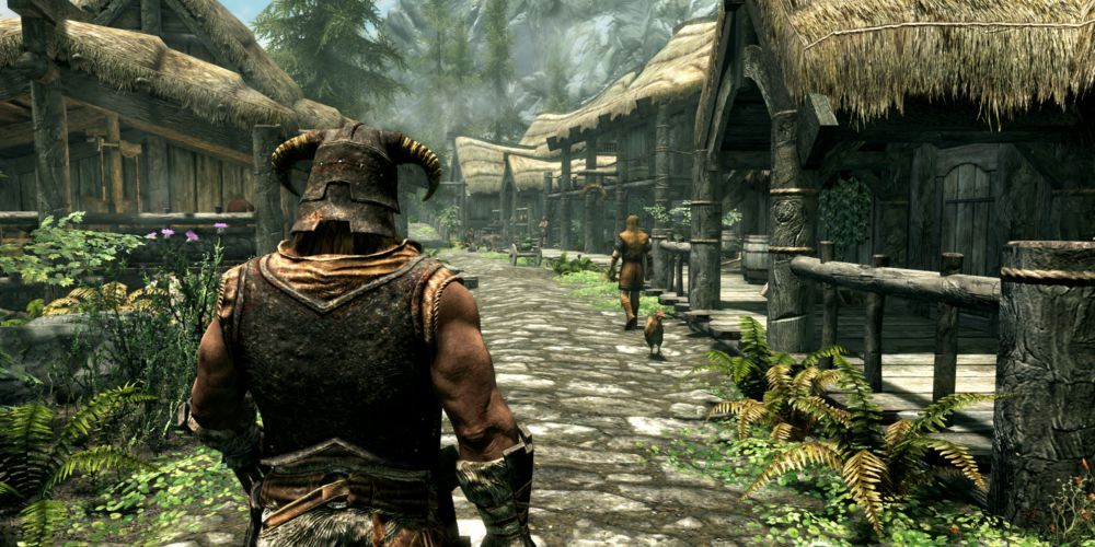 The Elder Scrolls V Skyrim character walking through a village