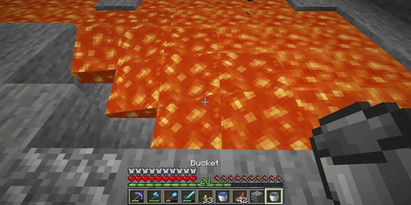 a player holding a bucket over a pool of lava in minecraft