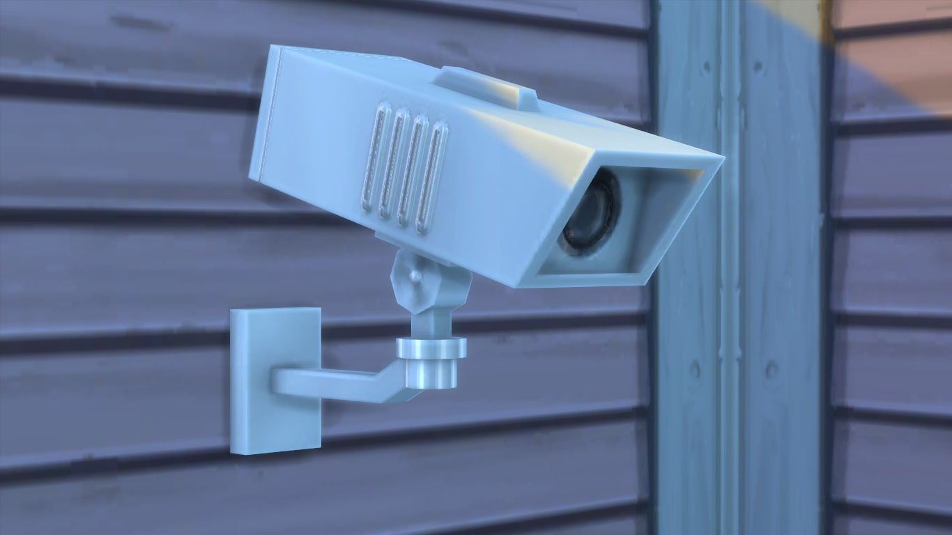 A surveillance camera on a wall.