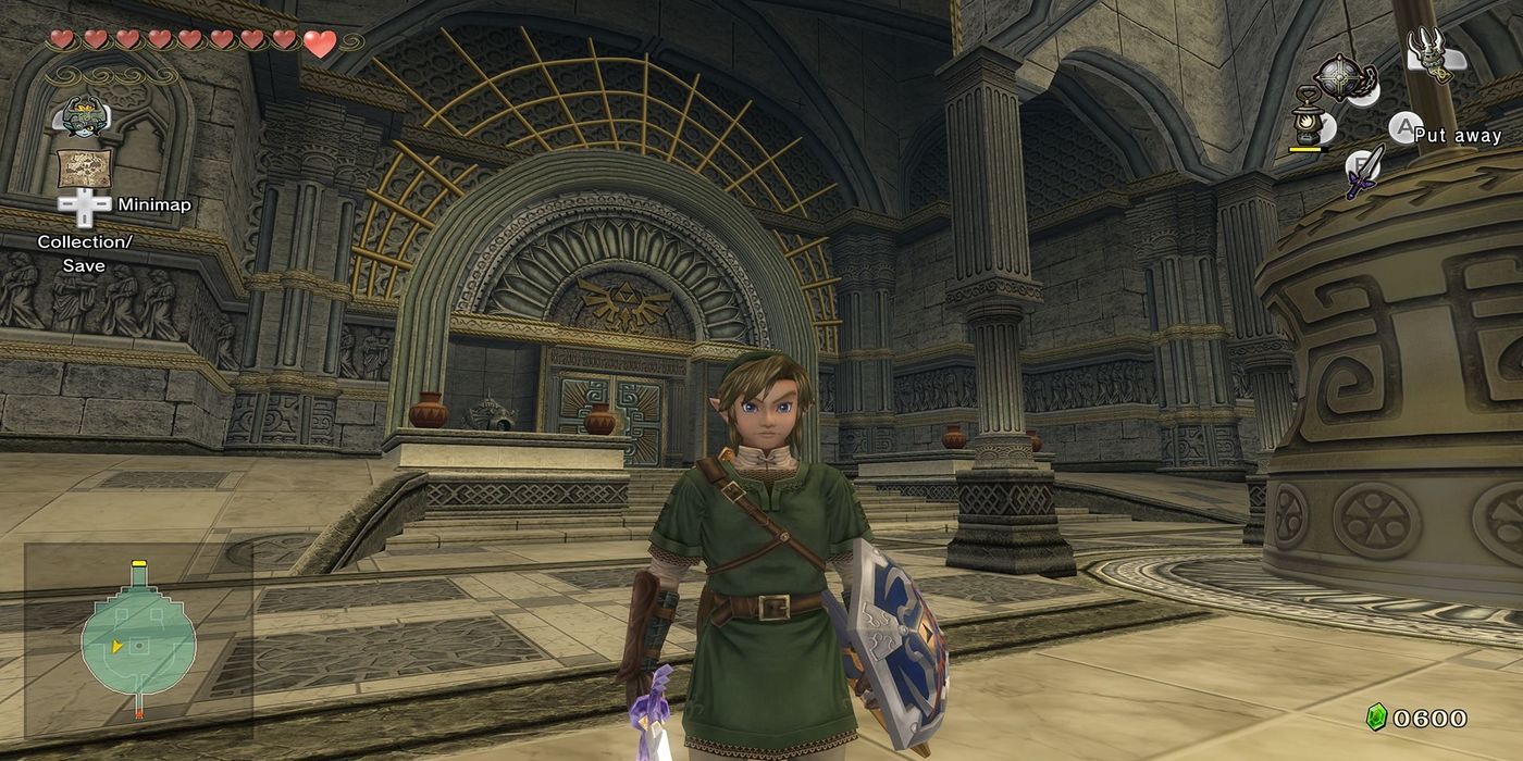 Link stands by a giant bell in a dungeon