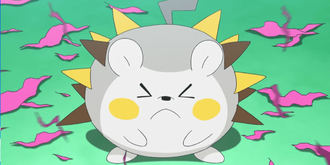 Togedemaru scrunching its face with ripped fabric surrounding it
