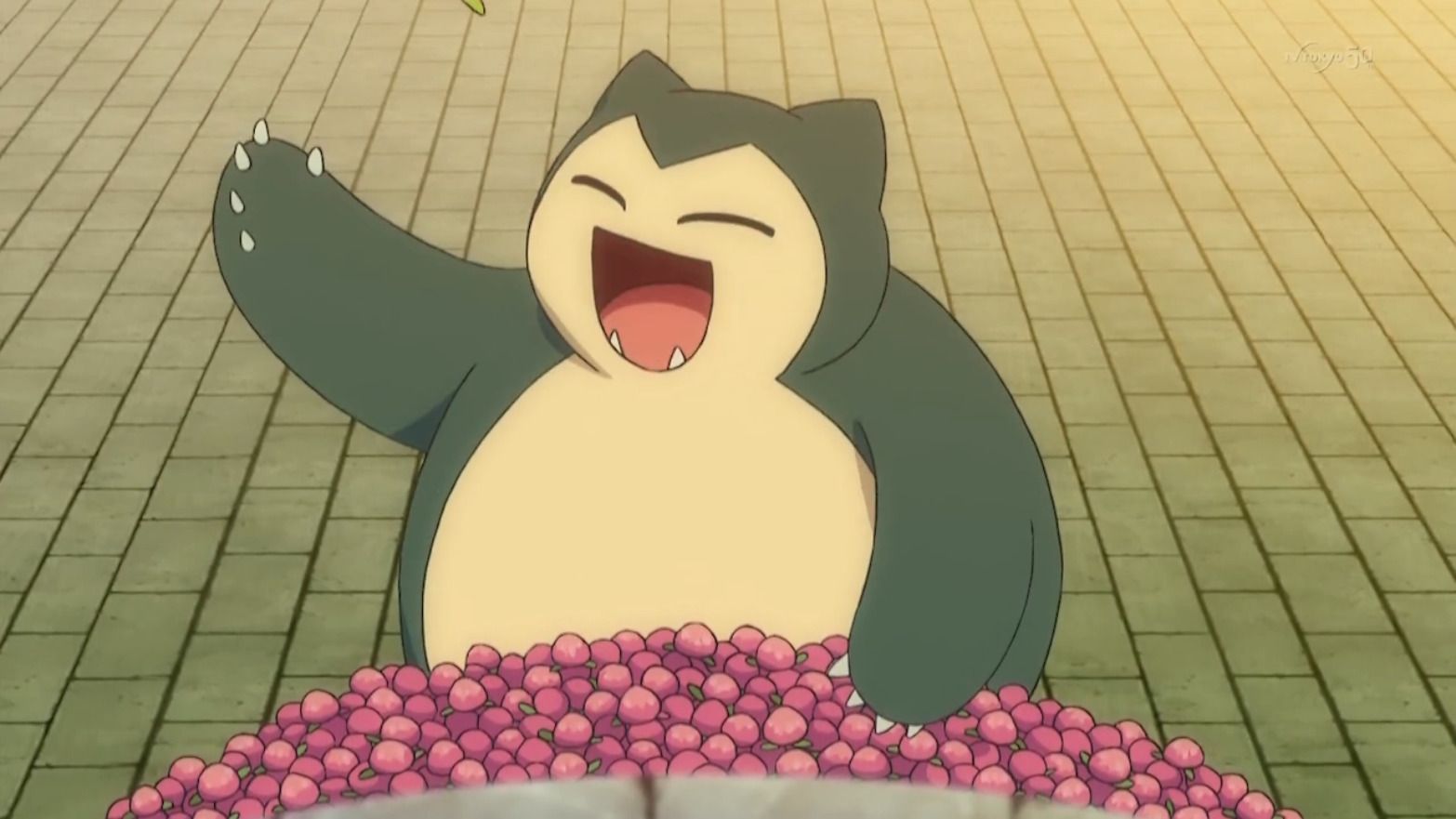 a happy snorlax with a ton of berries 