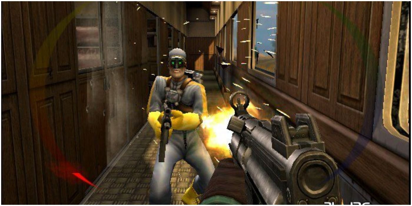 TimeSplitters first person view of the player shooting at an enemy holding a gun