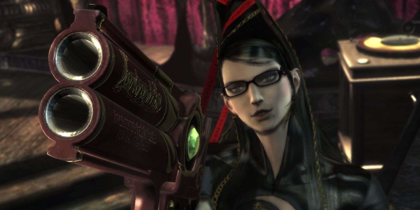 Bayonetta pointing a gun towards the screen in focus, while Bayonetta is unfocused in the background