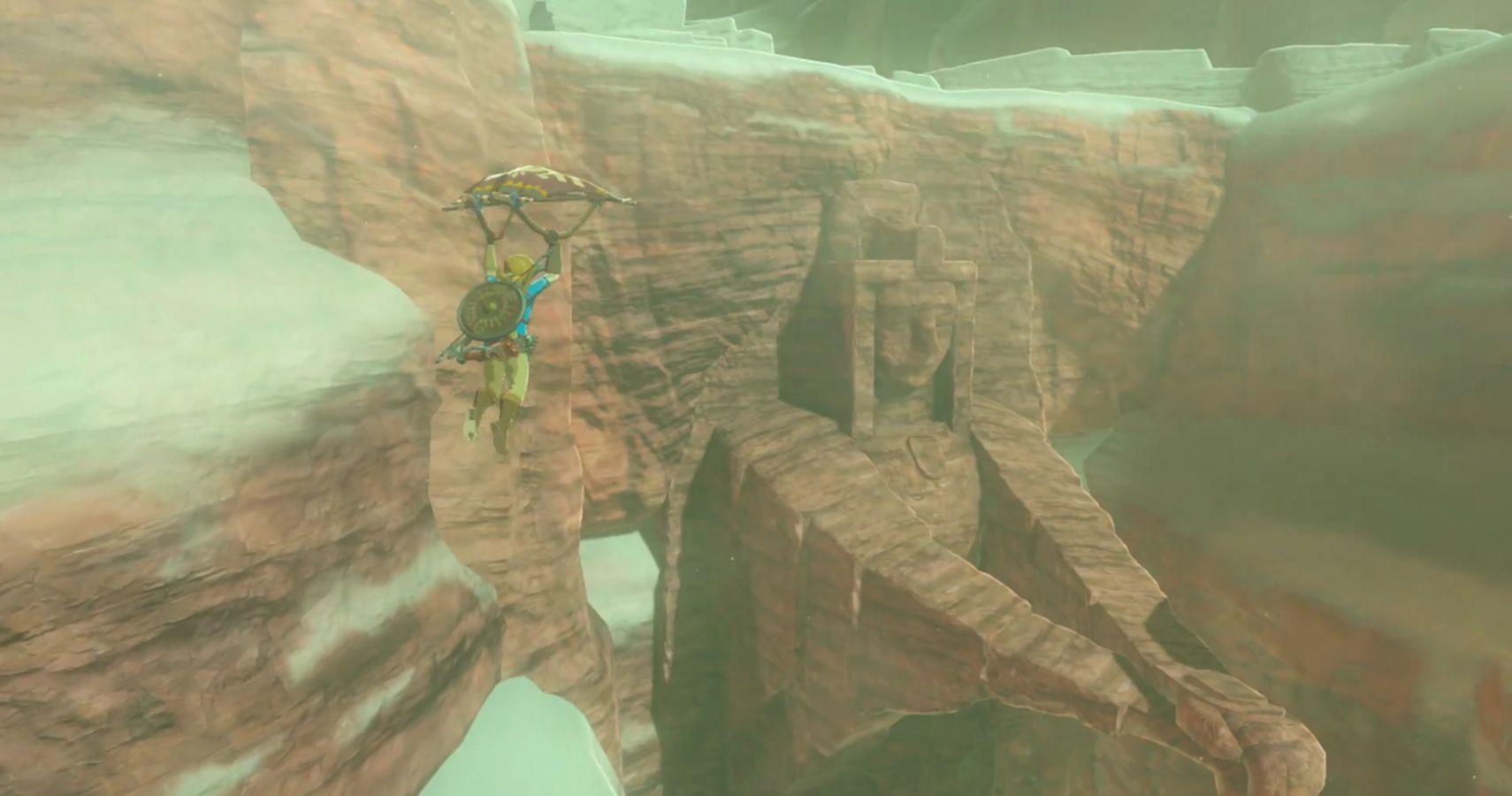 link paragliding toward the statue of the eighth gerudo heroine 