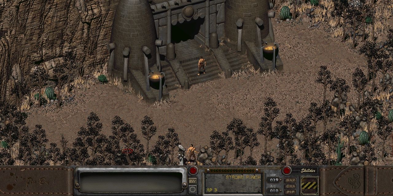 Fallout 2 Character standing at the entrance of a stone structure