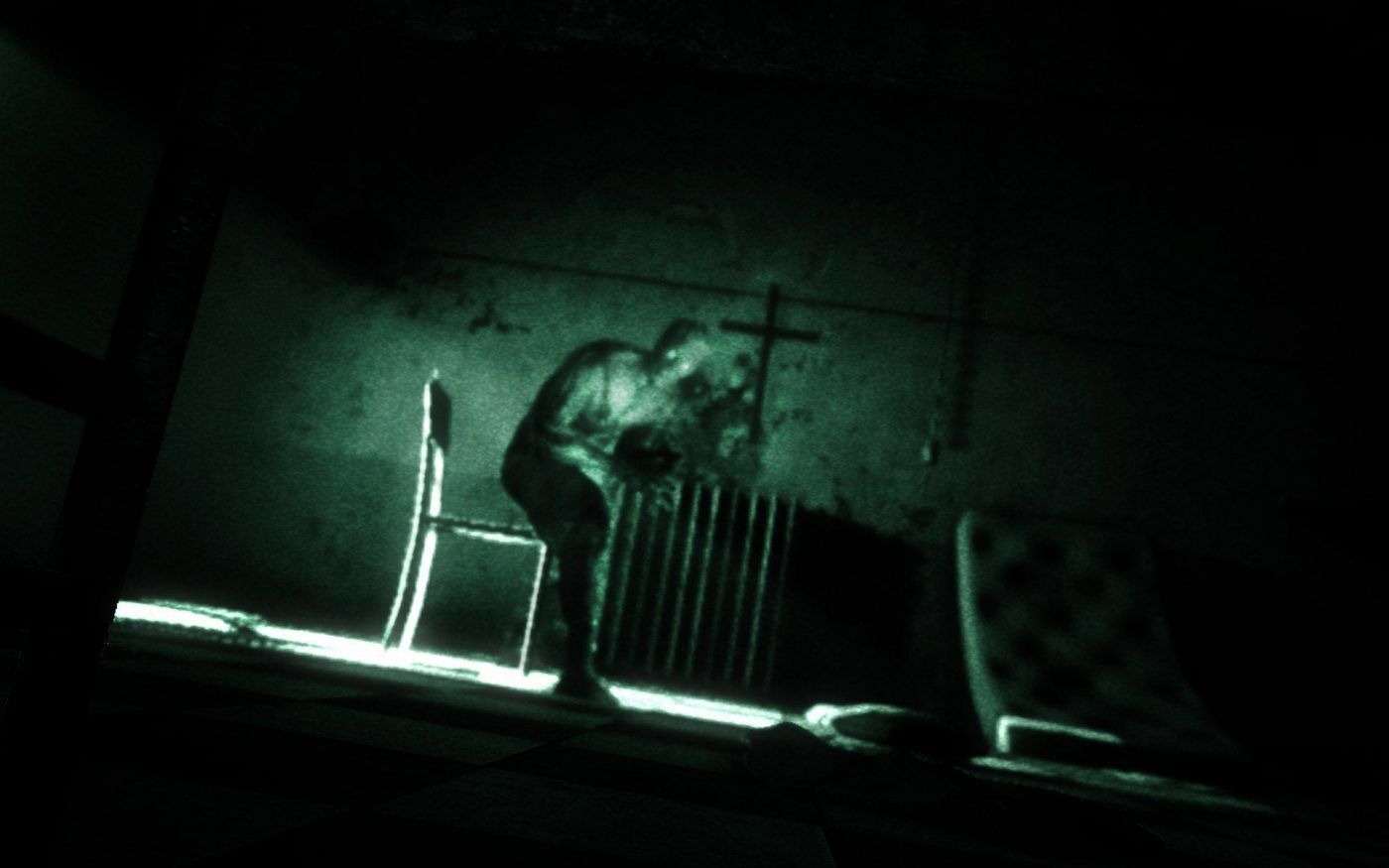 Outlast person in nightvision getting up from chair