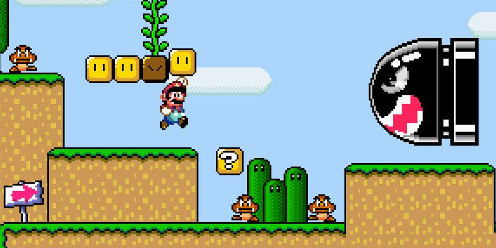 Mario hitting block with vine, goombas, and bullet bill coming at him in Super Mario World