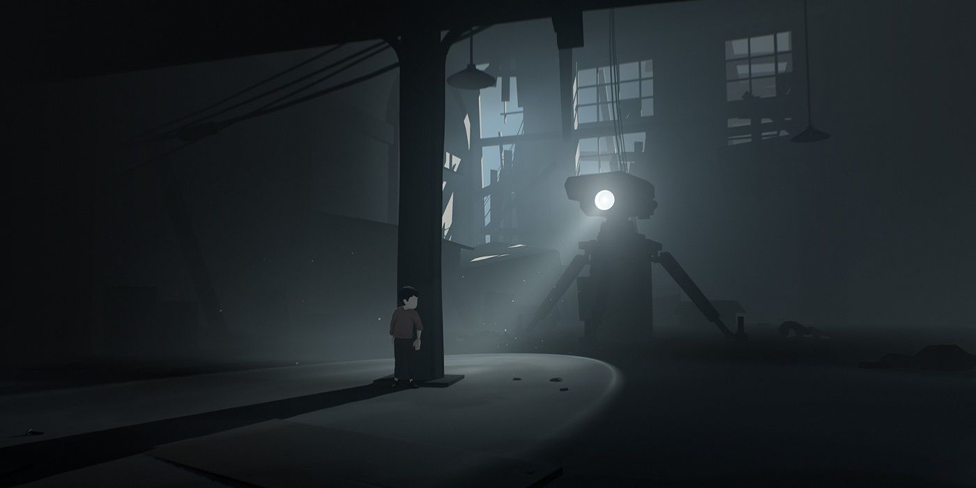 The main protagonist hiding from the flashlight lamp of a giant enemy robot as part of Inside's stealth puzzle.