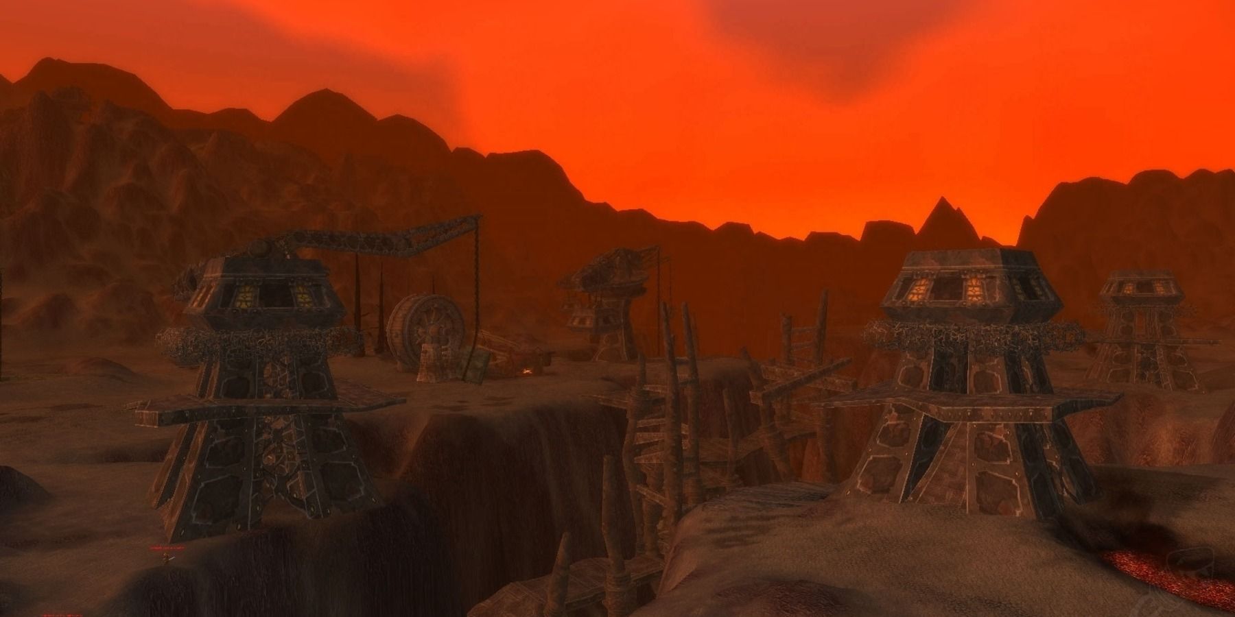 Classic world of warcraft, view of Searing Gorge landscape ith distant mountains and dwarven towers.