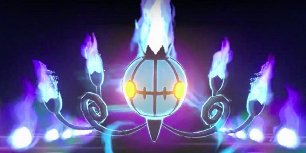 The Pokemon Chandelure, floating in the darkness with its blue and purple fires blazing.