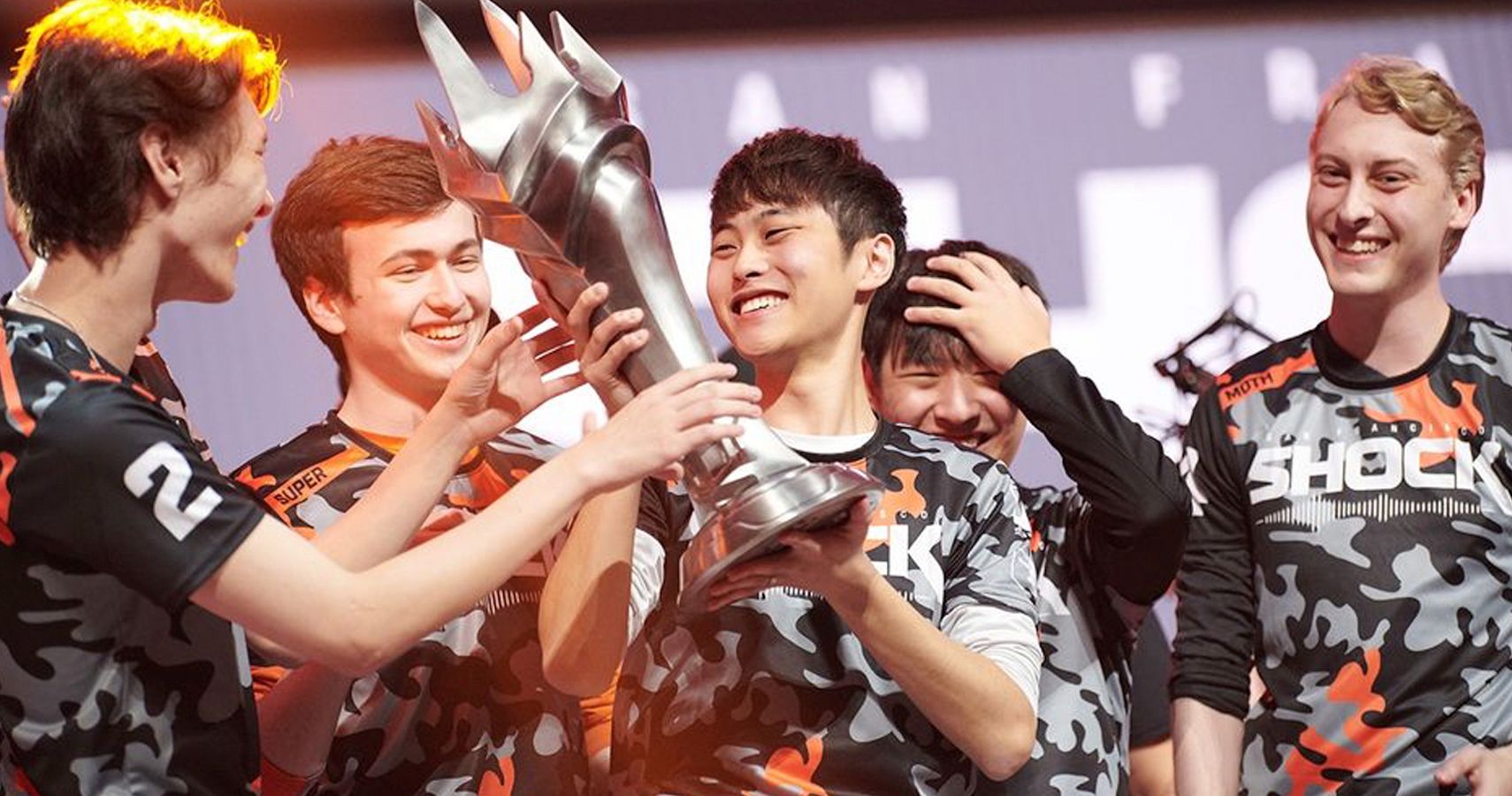 SF Shock hold a trophy after winning the 2019 Overwatch League Grand Finals Championship.