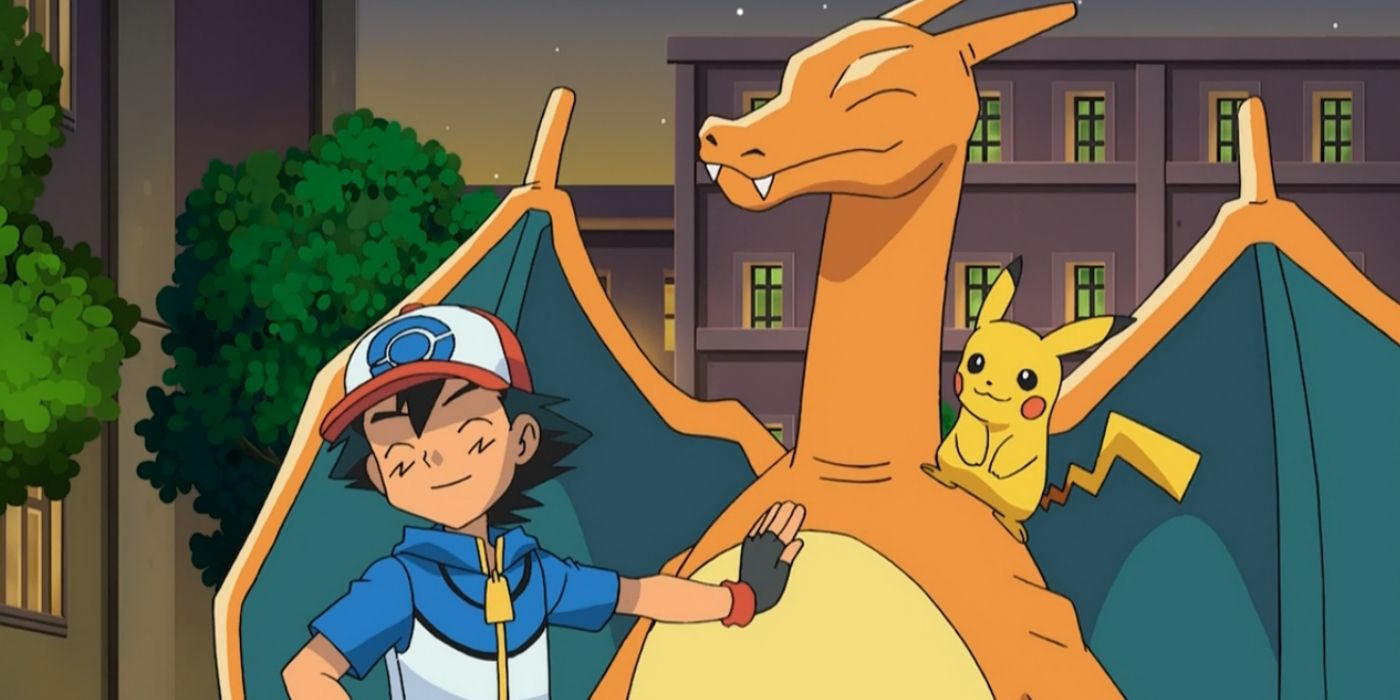 Ash Ketchum standing next to Charizard and Pikachu