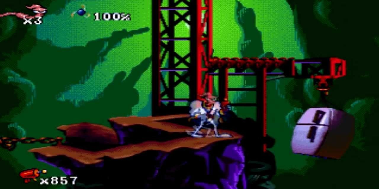 Earthworm Jim standing in valley stage with crane holding fridge