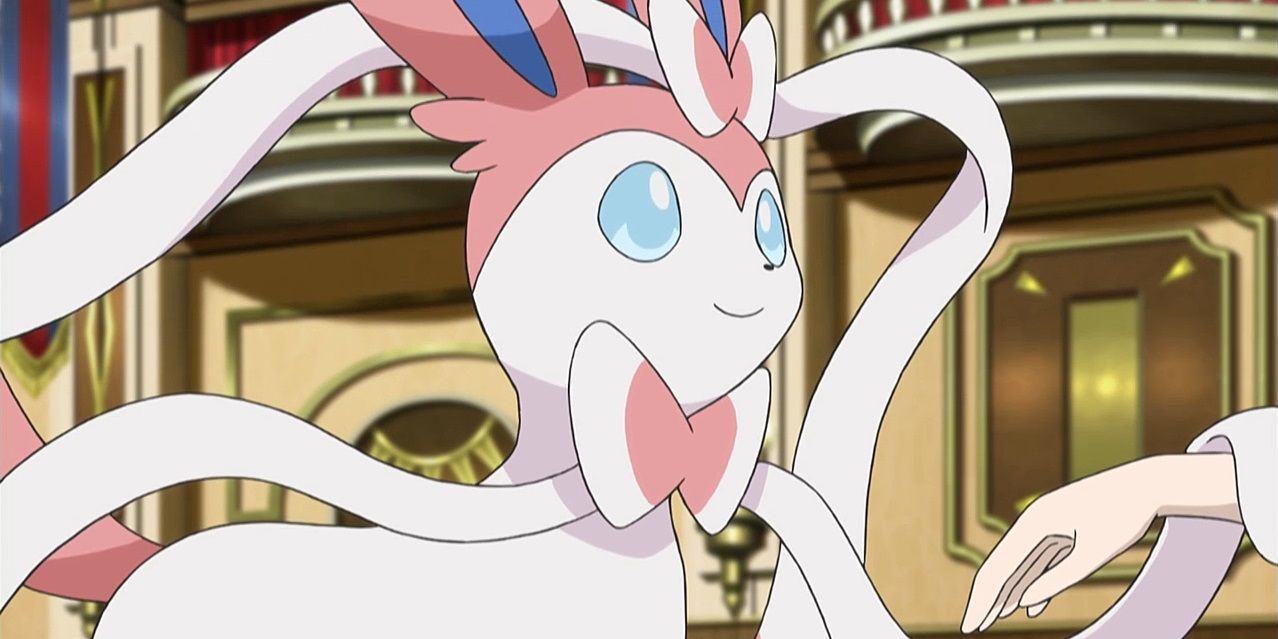 Sylveon standing proudly in a castle while its owner puts its hand under a ribbon