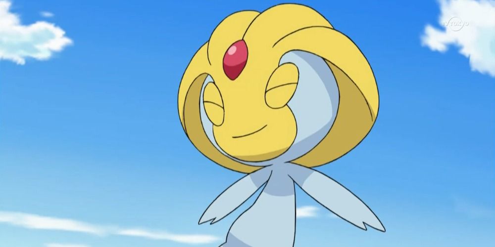 Uxie smiling while floating in the sky in the Pokemon anime.