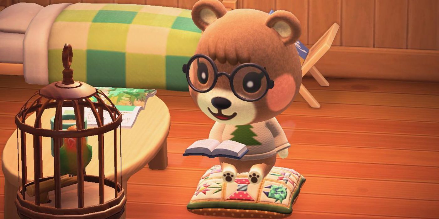 Maple sitting on a cushion and reading a book in Animal Crossing New Horizons.