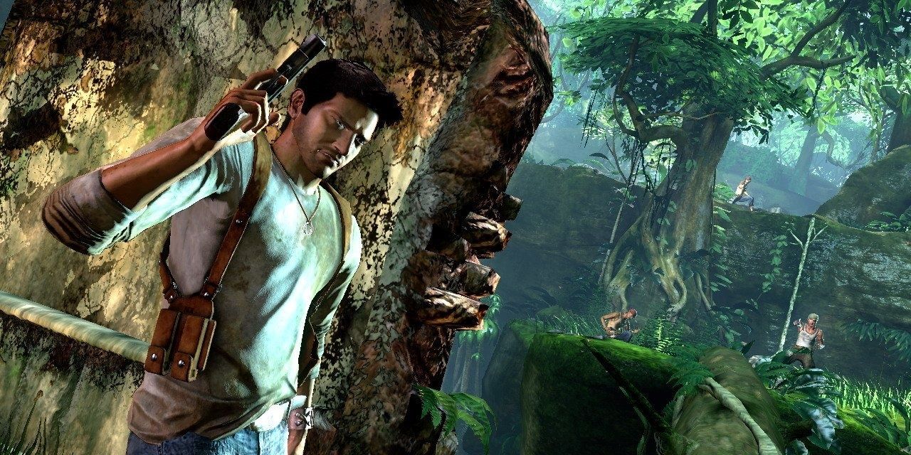 Nathan Drake holding a gun, against a wall