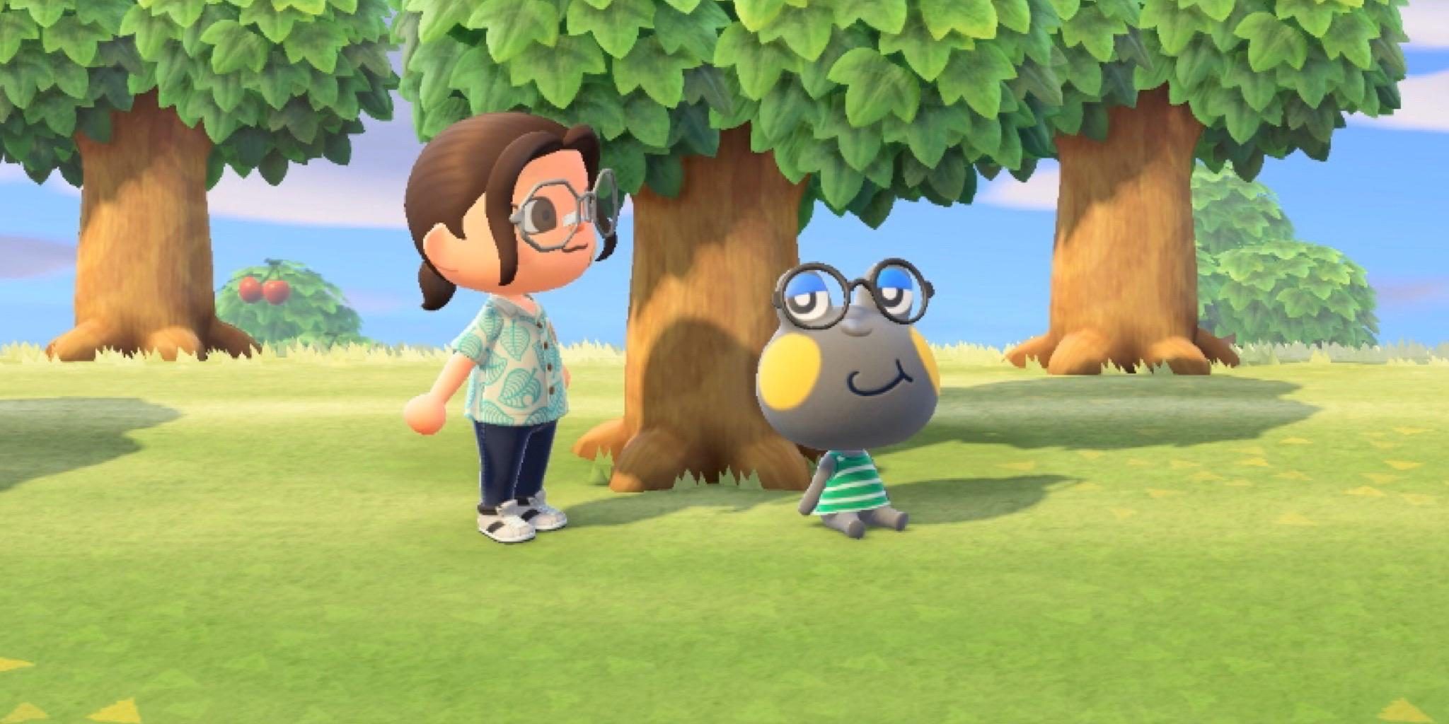 Huck looks up at a villager while sitting under a tree